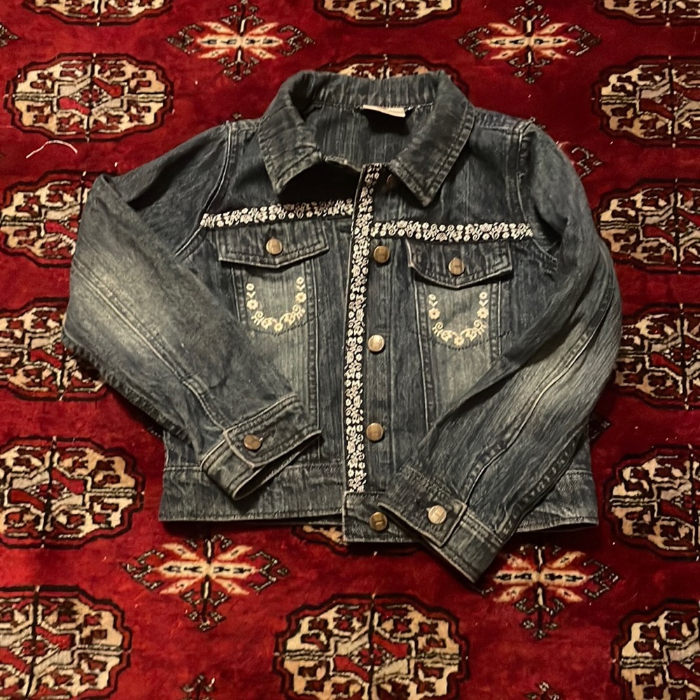 Cute Hanna Anderson denim jacket w flower trim detail. Hardly worn